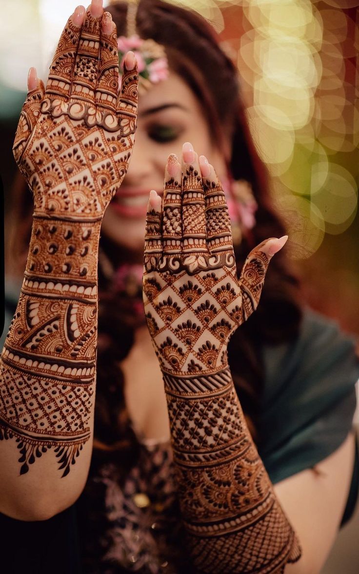 Traditional bridal henna design with paisley, lotus and mandala motifs on full hand