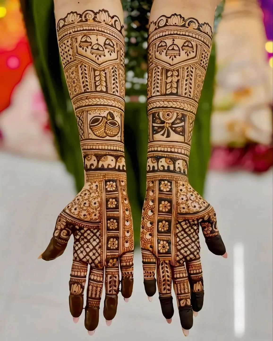 Modern bridal back hand henna with jewellery-inspired chains and rings pattern
