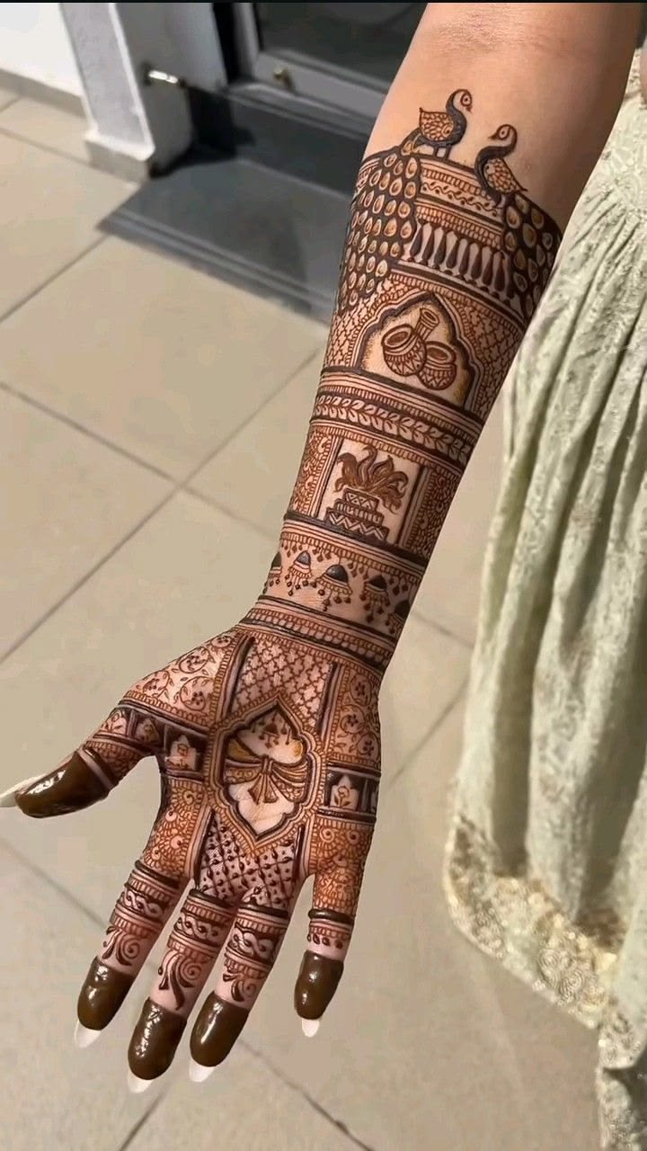 Bridal feet mehendi design with traditional patterns extending to ankles