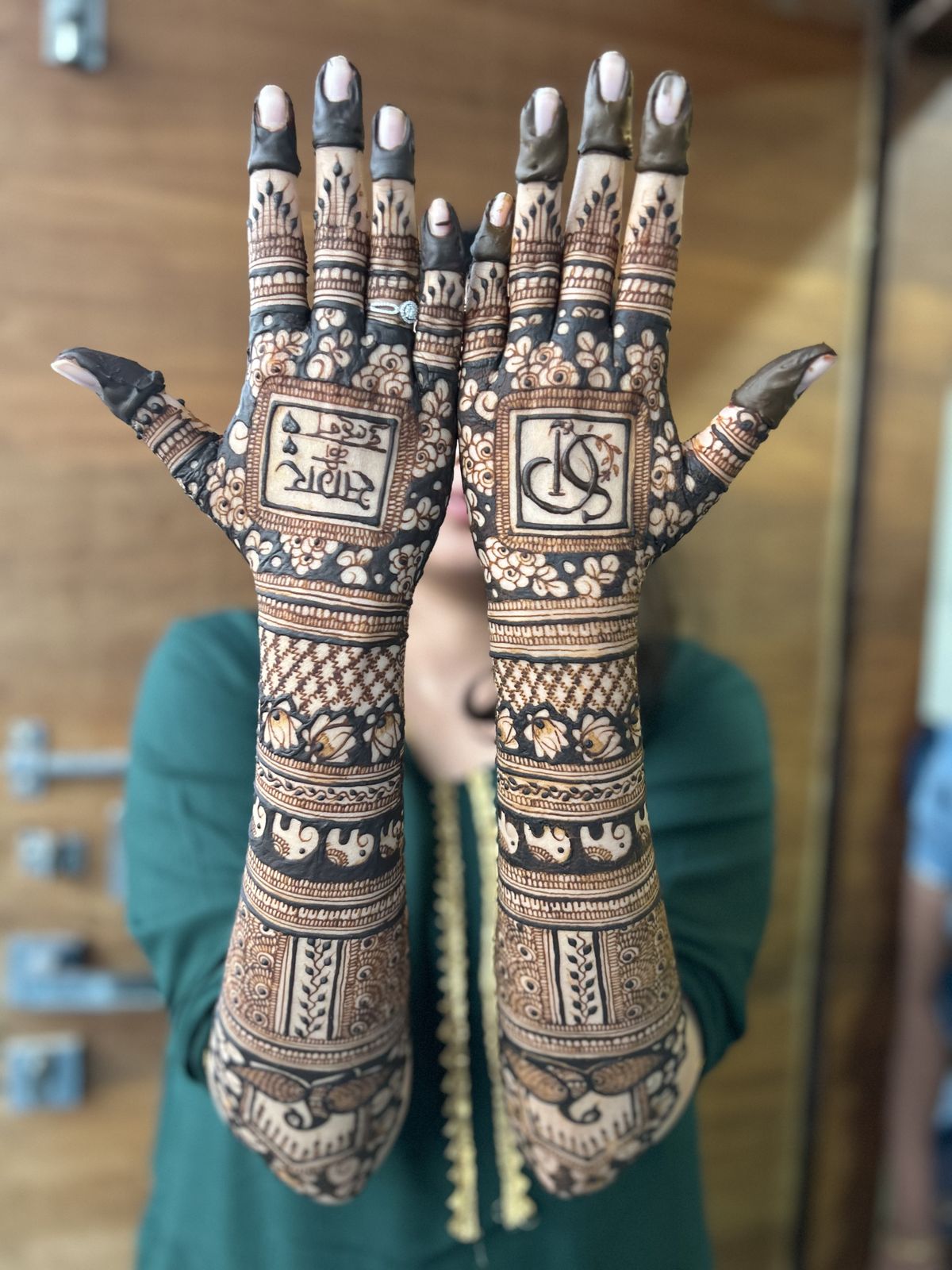 Detailed bridal feet henna with mandala on top of foot and vine patterns on ankle